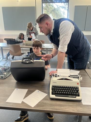 Learning about his typewriter